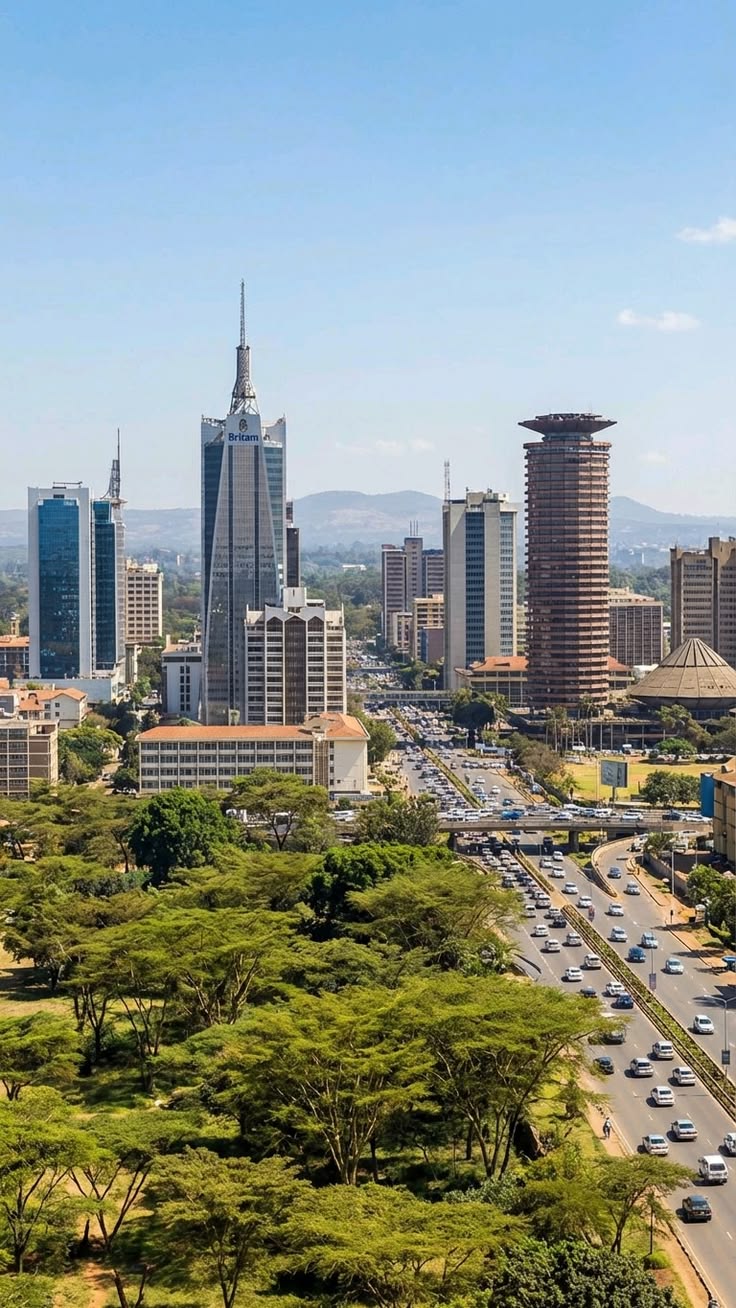 Nairobi's skyline rising beyond a canopy of acacia trees